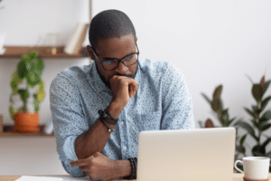 Concerned man on laptop